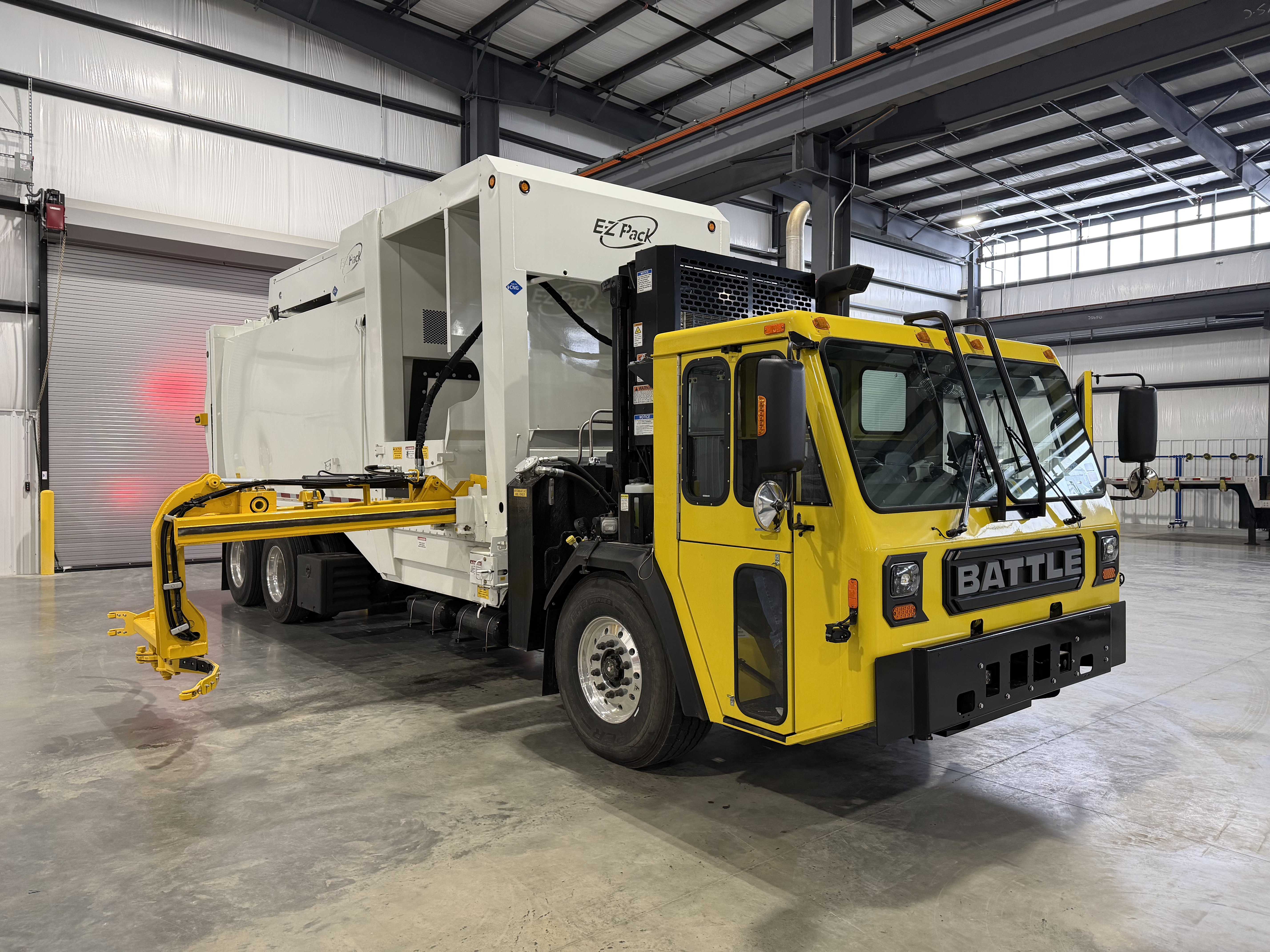 E-Z Pack Ranger manual side loader on a residential refuse route